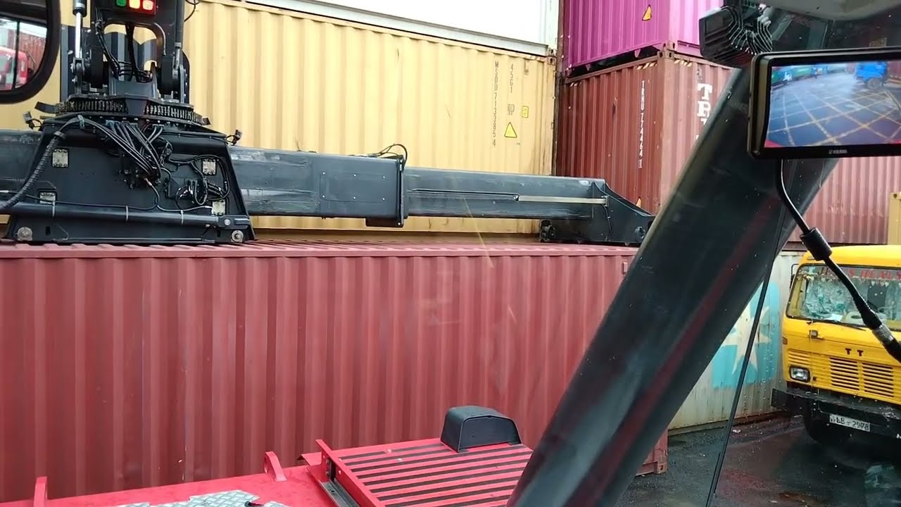 Kalmar Reach stacker with a tilting spreader for container handling