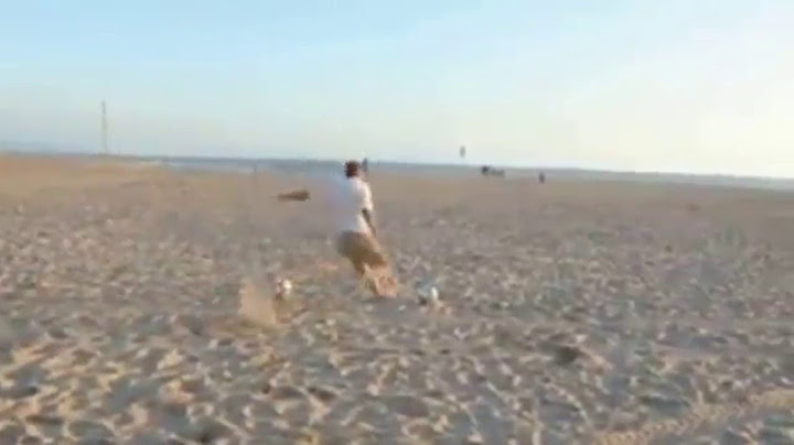 Soccer Player David Beckham kicking balls into distant bins