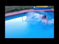 Man jumping in a swimming pool