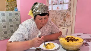 Woman lives alone on the top of a mountain. Cooking a traditional Carpathian dinner