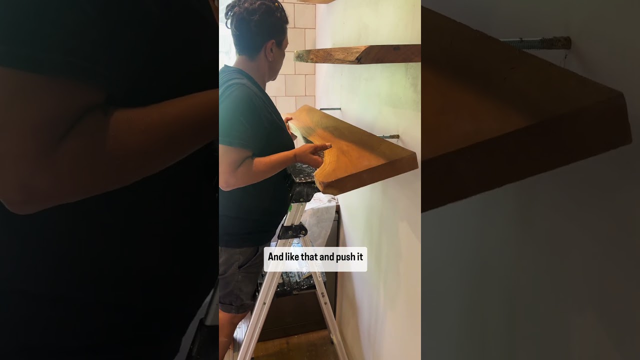 Handing solid timber floating shelves. 
