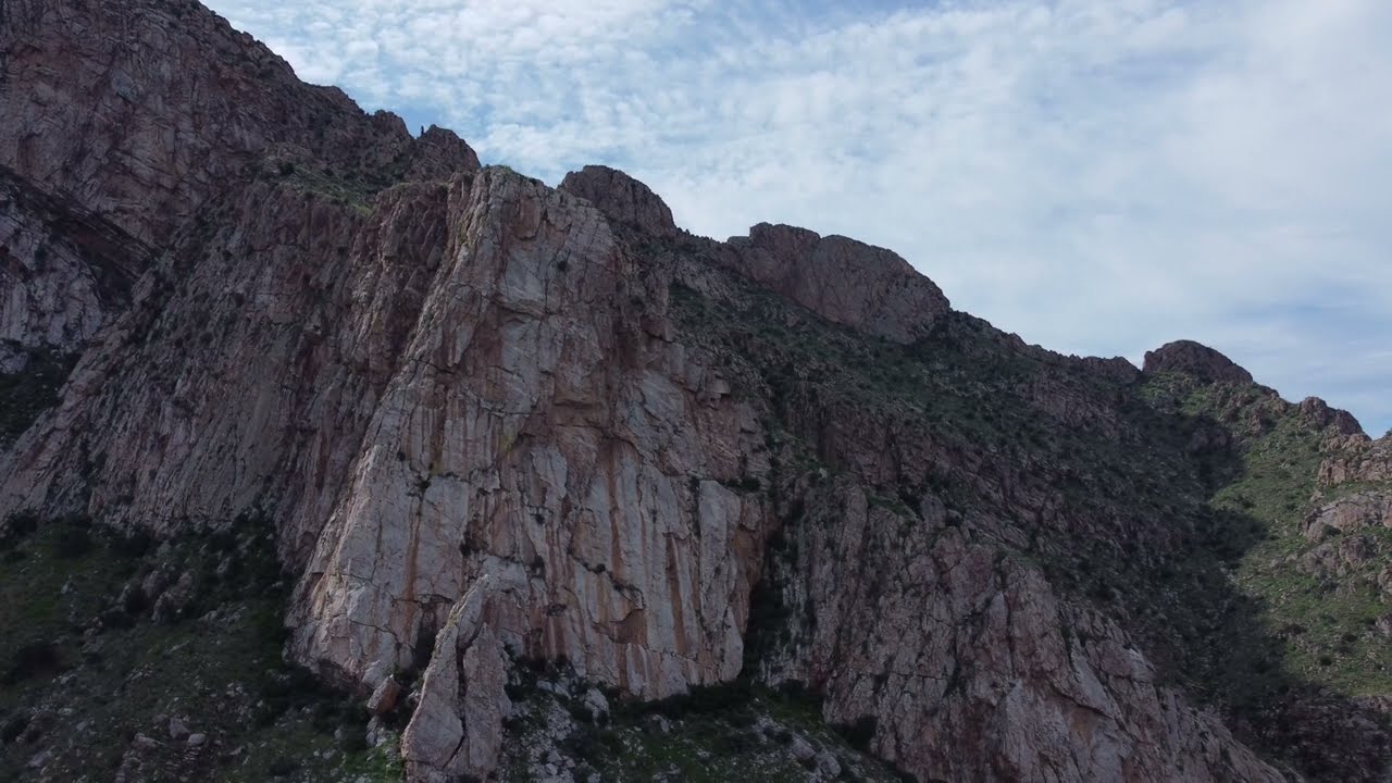 Sheer Rock Face Drone 4K Flight
