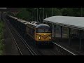 Freight trains ukgbrf 69001 69002 thrashing full tilt plus a class 59 among others