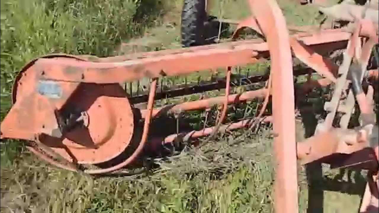 Allis Chalmers Model 77G Hay rake behind a Coop E3 tractor YouTube