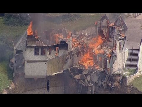 Burning down the house: Texas family burn down luxury home that hangs over 75ft cliff