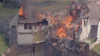Burning down the house: Texas family burn down luxury home that hangs over 75ft cliff