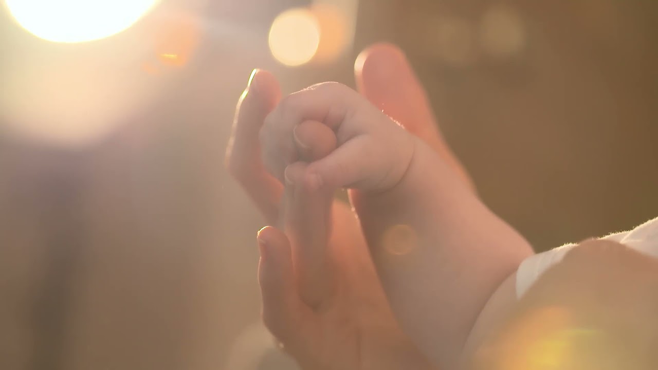 Baby Holding Daddy`s Finger