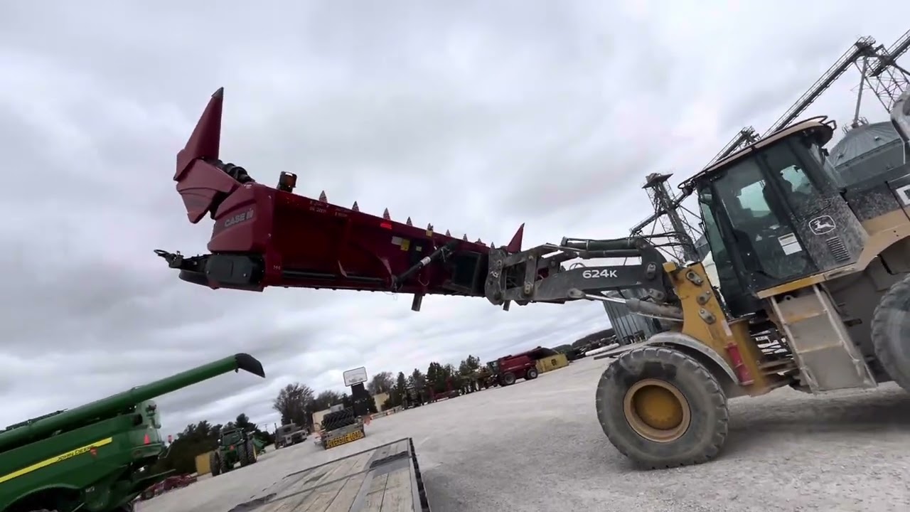 Picking up Case IH 4412 corn head at Randall Brothers in Holgate Ohio, flat land and big equipment