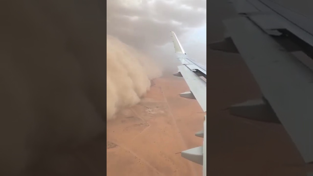 Avião voa próximo a uma tempestade de areia na Arábia Saudita