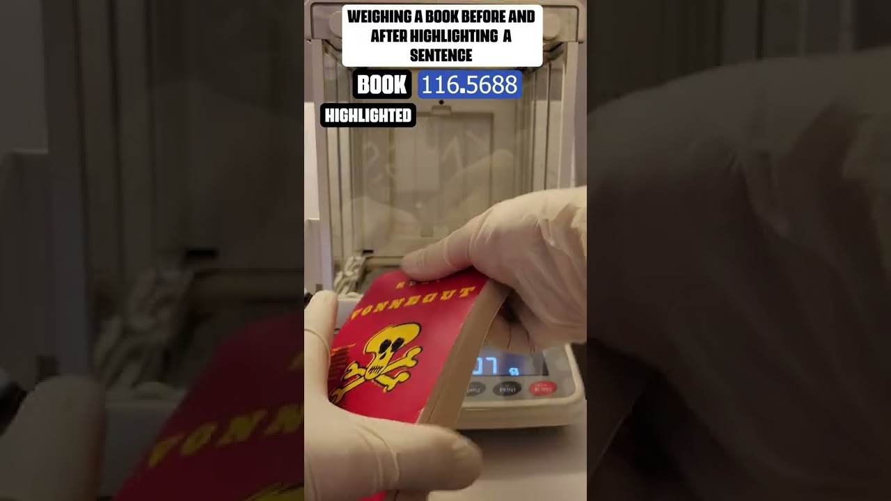 Weighing a book before and after highlighting a sentence. 