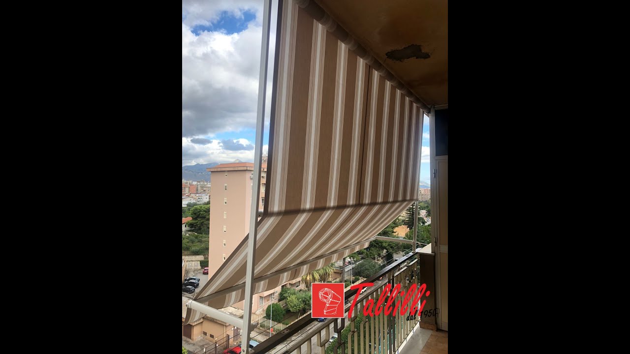 Tenda da sole a caduta motorizzata con guide