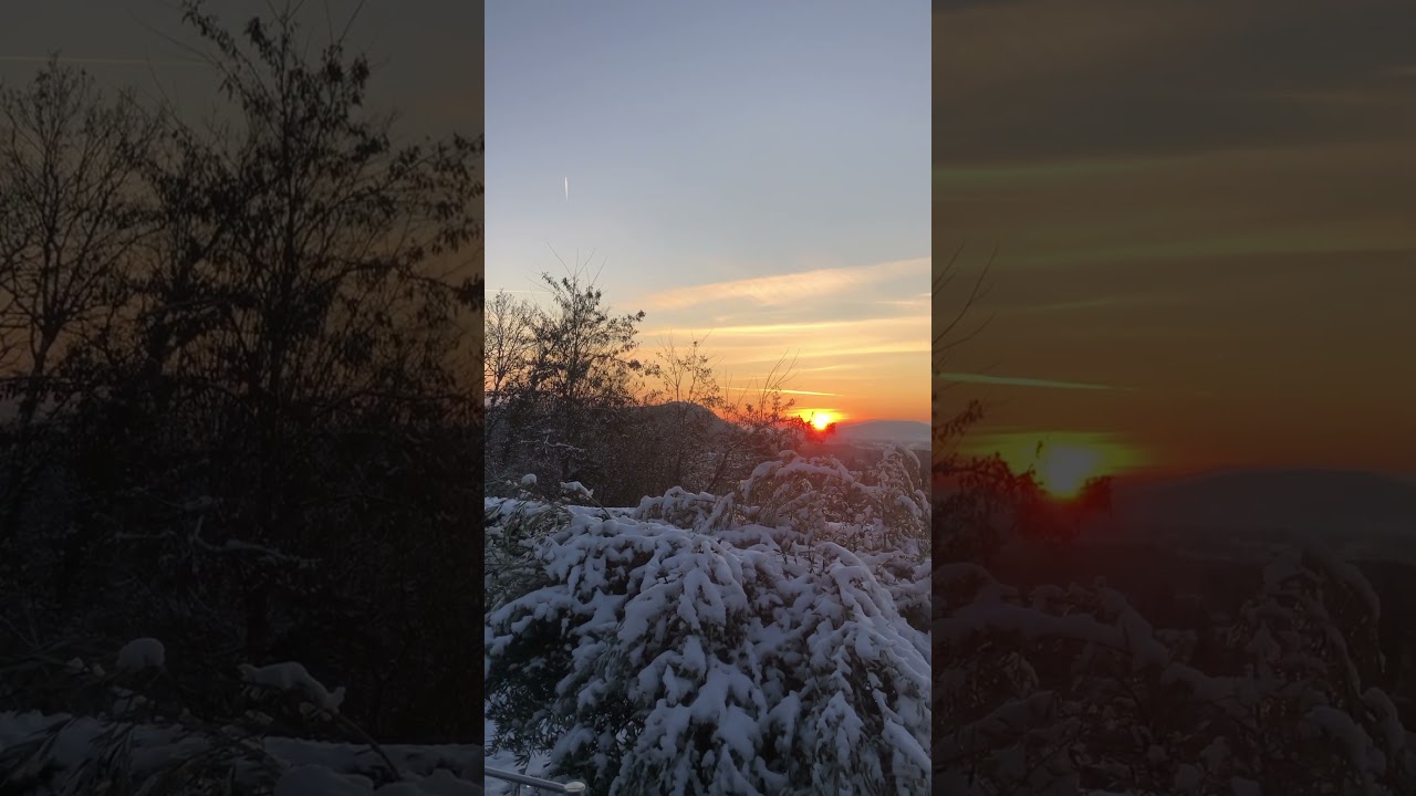 Winter panorama over Lake Geneva and surrounding mountains at sunset 