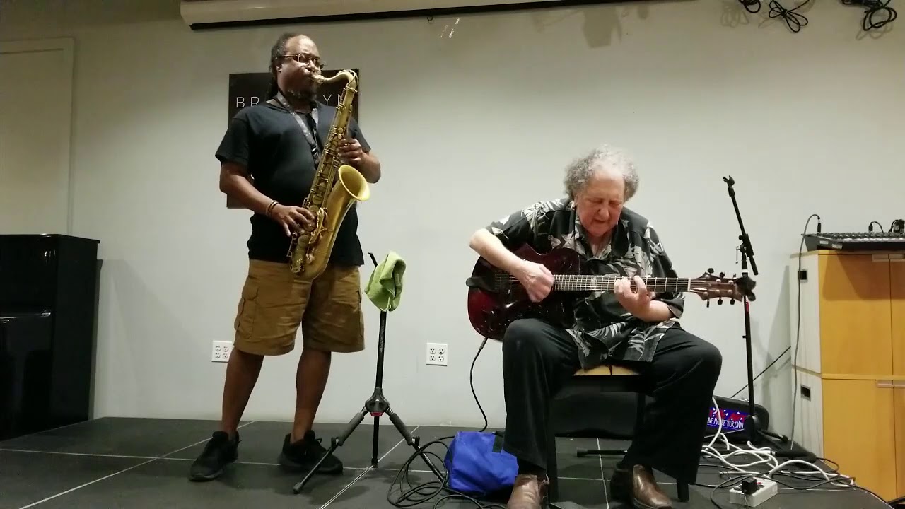 Ras  Moshe Burnett and Dom Minasi