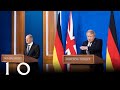 Prime Minister Boris Johnson and Chancellor Olaf Scholz of Germany hold a press conference.