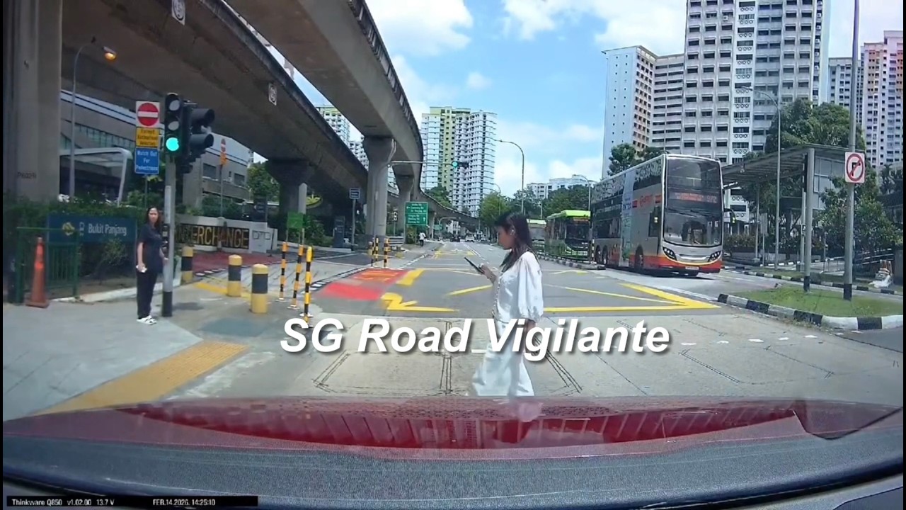 14feb2026 1 petir road pedestrian jaywalking eyes on phone , ignoring red light signal