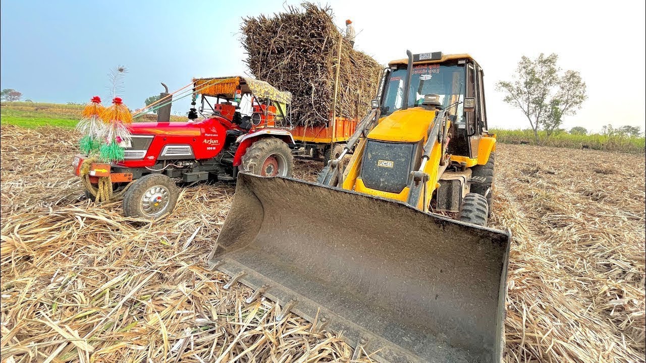 JCB 3dx Backhoe Machine Mahindra Aarjun traktar sugarcane trolley londed 