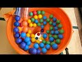 Make a marble run course using two transparent long pipes and a large funnel. ( billiard balls)