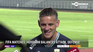 FIFA MATCHES; HERDMAN BALANCES ATTACK, DEFENSE