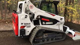 Bobcat T595 grades driveway with SkidMax 3X