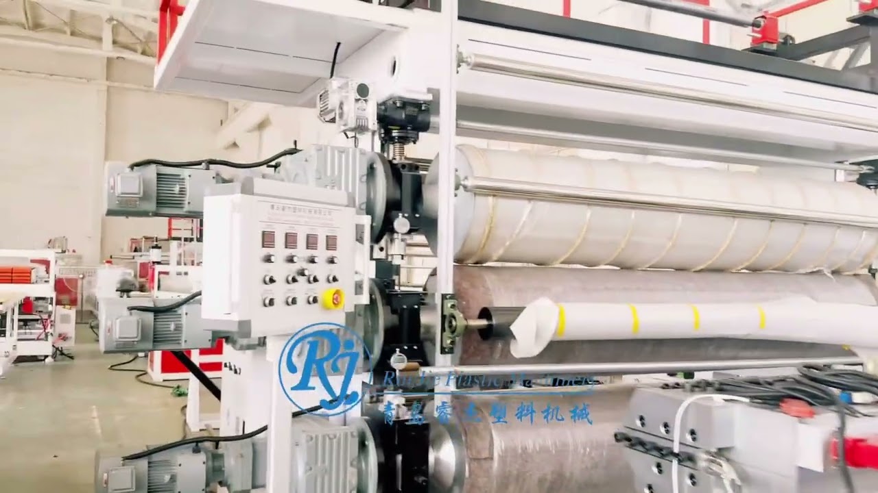 Two lines 2000mm width soft PVC roll flooring machines.