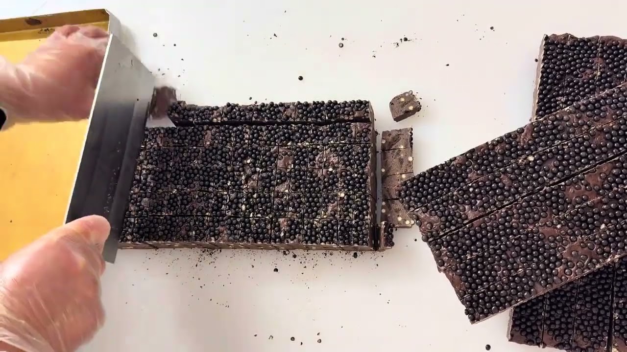 Immersive cutting of a large chocolate square brick