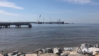 Crews are working to remove the overturned Golden Ray cargo ship