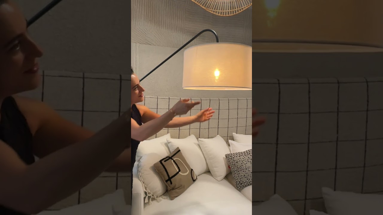 Enhance your living room with our modern Milia floor lamp featuring a sleek white shade.