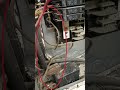 Improper wiring observed: lamp cord used as permanent wiring and directly connected to a breaker.