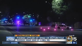 Phoenix officer hit while on motorcycle