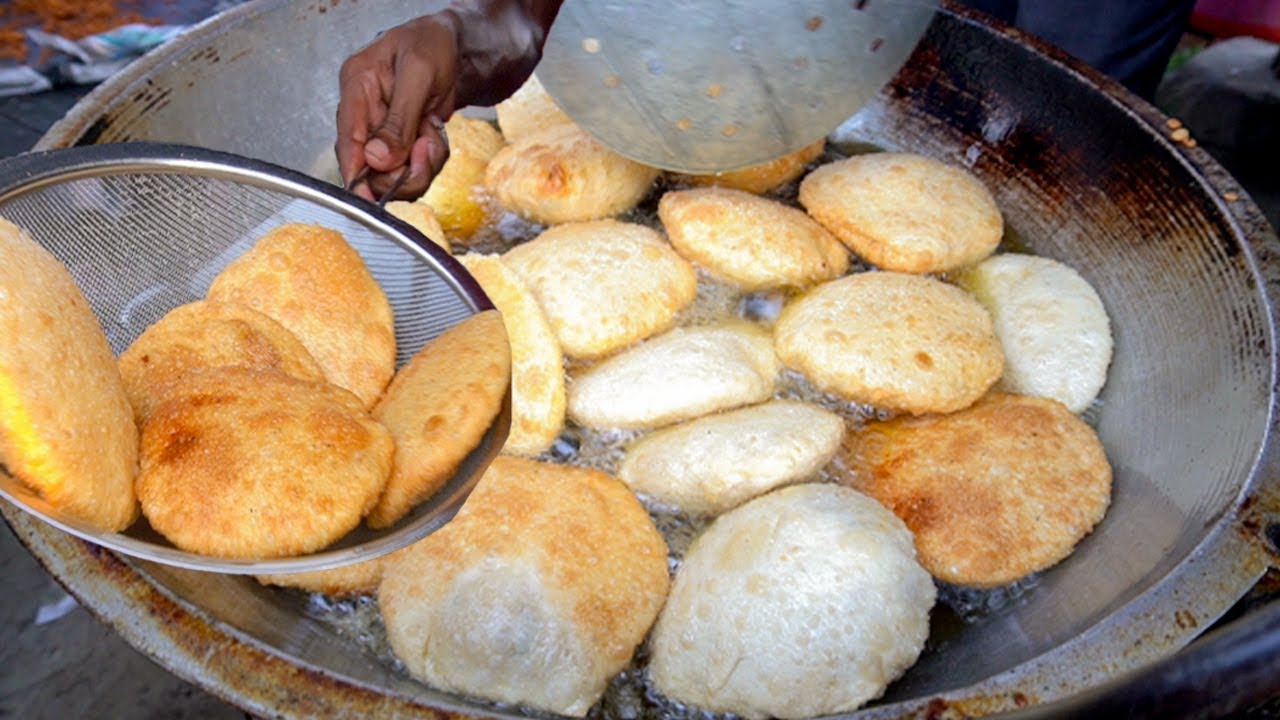 Biggest Street Puri. One man making huge puri in Street