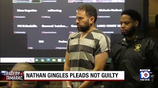 Man pleads not guilty to killing 3, including estranged wife