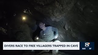 Divers race to free villagers trapped in cave