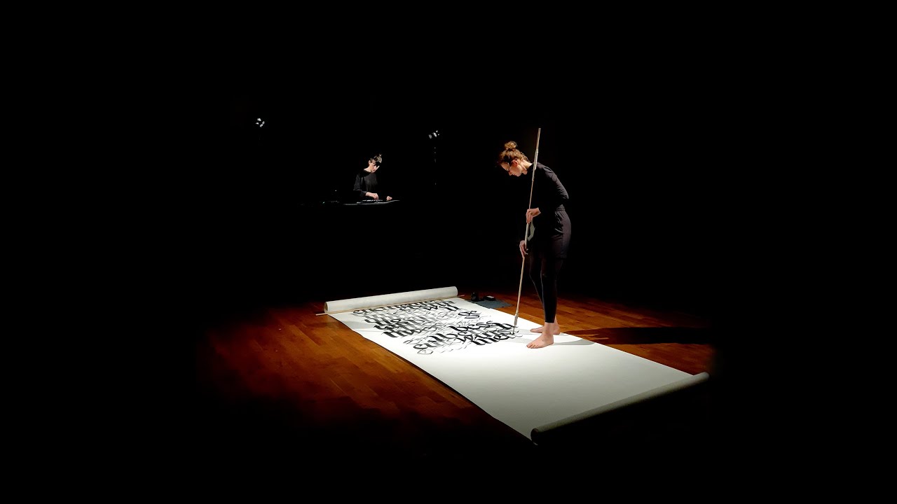 performative calligraphy by Em Krallmann