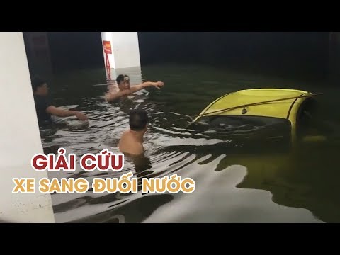 Video Giải cứu ô tô sang bị đuối nước dưới hầm chung cư ở Đà... - youtube