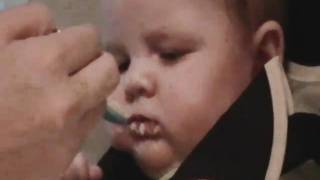 Ethan eating rice cereal
