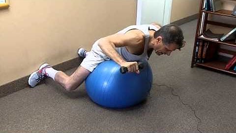 Back extension with rotator cuff external rotation on the ball 112 0545