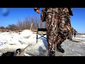 Ловля щуки на Амуре зимой. The fisherman catches a pike on Amur River in the winter.