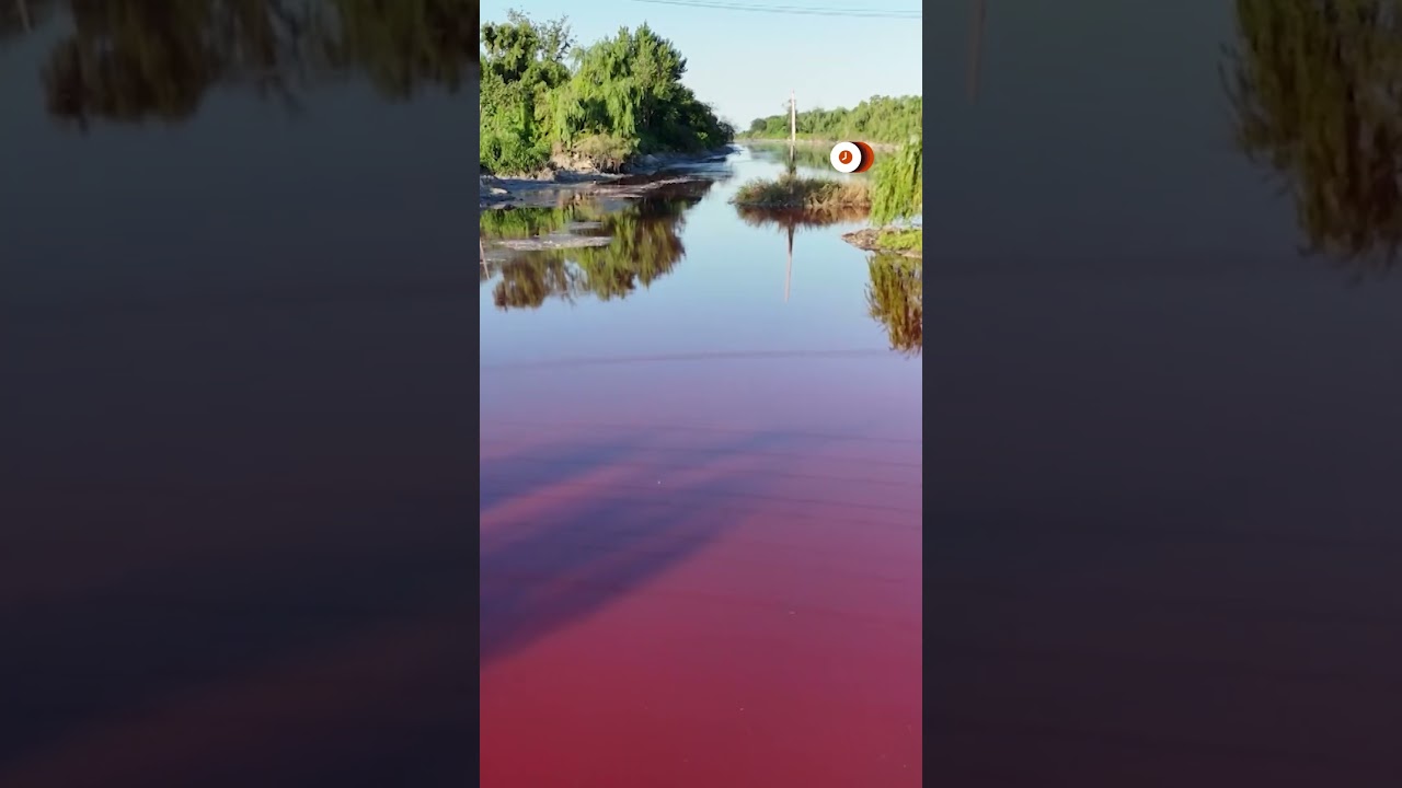 Argentine river turns bright red