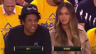 Lol. Beyonce looks jealous as a lady leans over her to talk to Jay-Z during a bascket ball a game