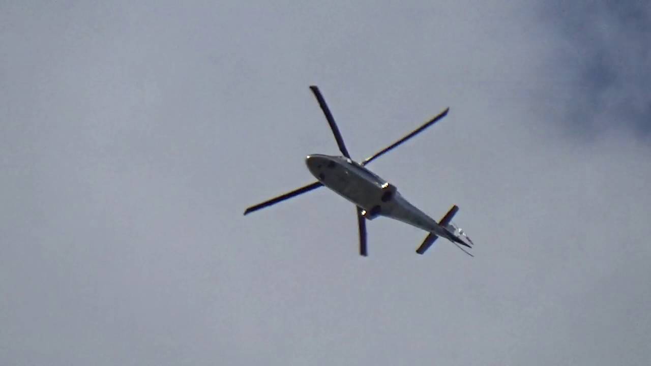 Quinnasette Ltd AgustaWestland AW109E Power G-WOFM flying over Harmans Water