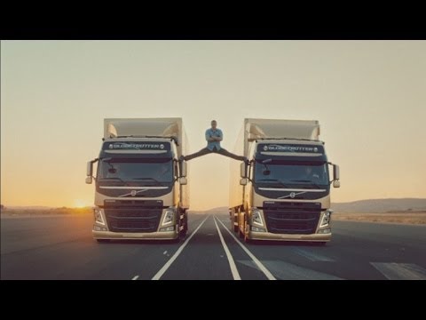 Jean-Claude Van Damme performs splits between two moving Volvo trucks