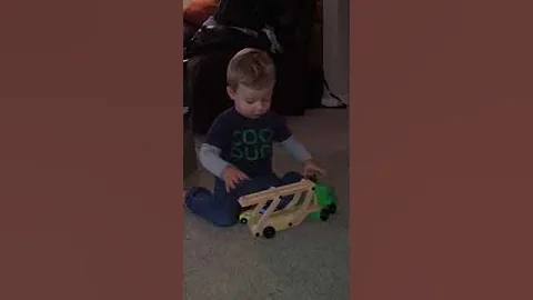 Matty plays with car carrier