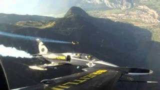 Jet Man Flies With jet pack Over Swiss Alps