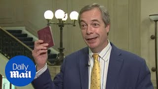 Nigel Farage celebrates the new, blue, post-Brexit passport - Daily Mail
