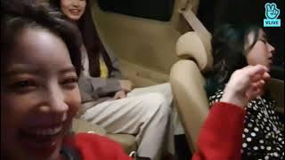Dahyun laughing at Chaeyoung sleeping in the car.