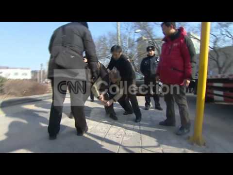 CHINA: POLICE ATTACK CNN CREW (ON CAM!)