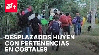 Desplazados de Chicomuselo, Chiapas, huyen de la violencia con sus pertenencias en costales