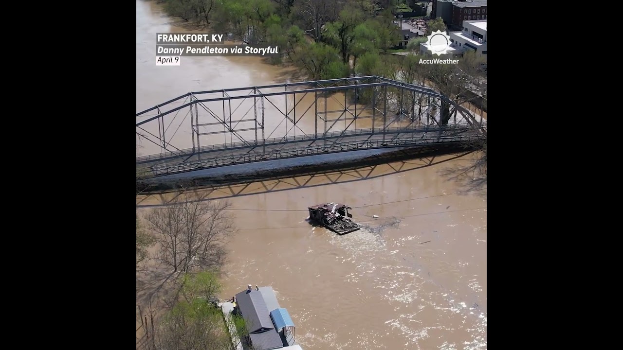 Barn Floats Down Flooded River, Hits Bridge