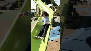 Emily slow-mo down the slide