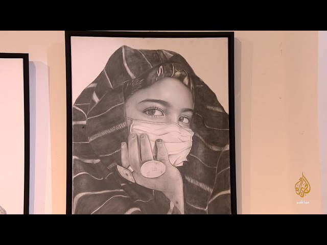 معرض للرسم يحاكي جائحة كورونا تحت عنوان "إصرار" في العاصمة الليبية طرابلس
